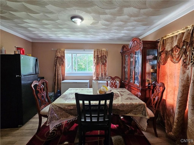 1125 Adams St, Utica, NY 13501 - dining space with wood finished floors and ornamental molding