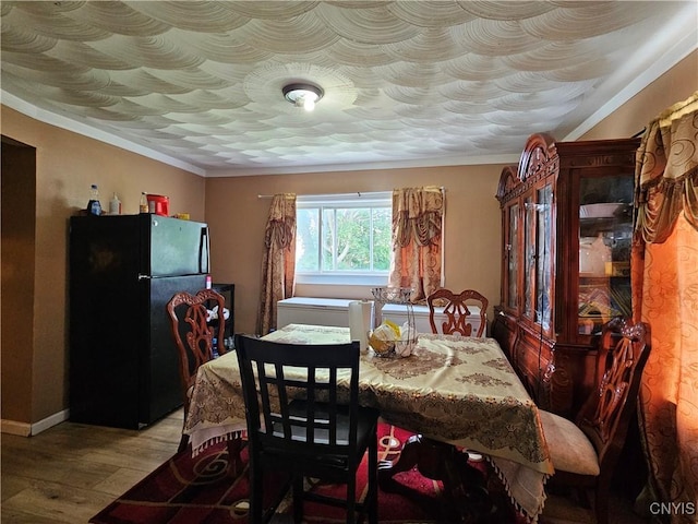 1125 Adams St, Utica, NY 13501 - dining room with light wood-type flooring and crown molding