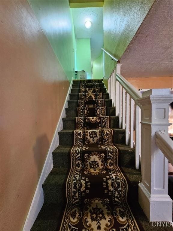 1125 Adams St, Utica, NY 13501 - staircase with baseboards