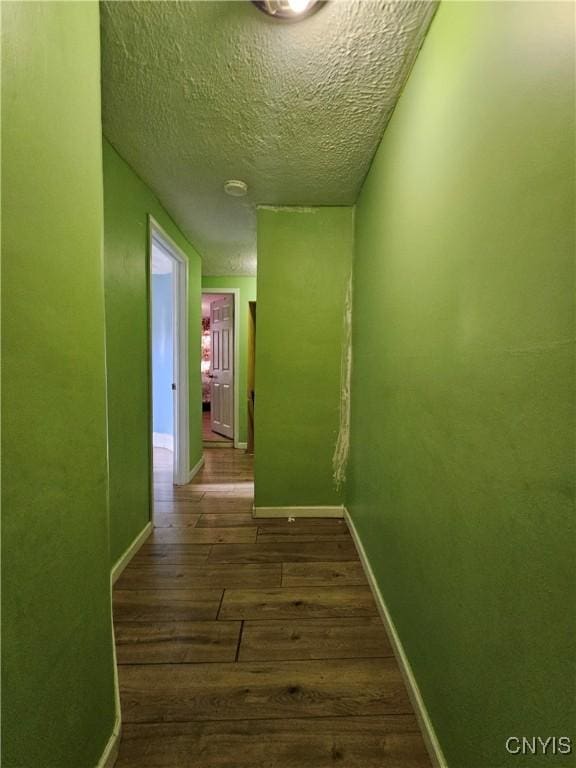 1125 Adams St, Utica, NY 13501 - hallway featuring dark wood finished floors and a textured ceiling
