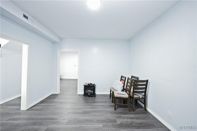 290 Riverside Ave, Buffalo, NY 14207 - living area featuring wood finished floors and a wood stove