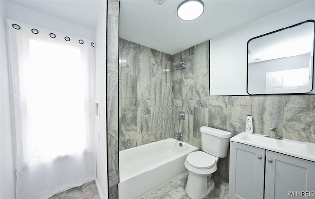 290 Riverside Ave, Buffalo, NY 14207 - full bathroom featuring  shower combination, vanity, marble look tile flooring, and tile walls