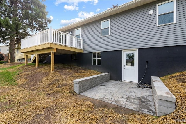 105 Benoit Dr, Geddes, NY 13209 - rear view of property with a deck and a patio