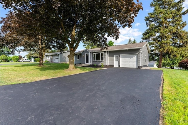 105 Benoit Dr, Geddes, NY 13209 - ranch-style home featuring a garage, asphalt driveway, and a front yard