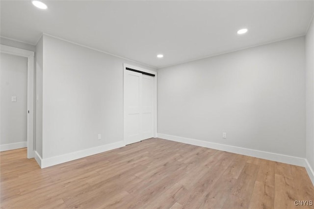105 Benoit Dr, Geddes, NY 13209 - unfurnished bedroom with light wood-style flooring, recessed lighting, and a closet