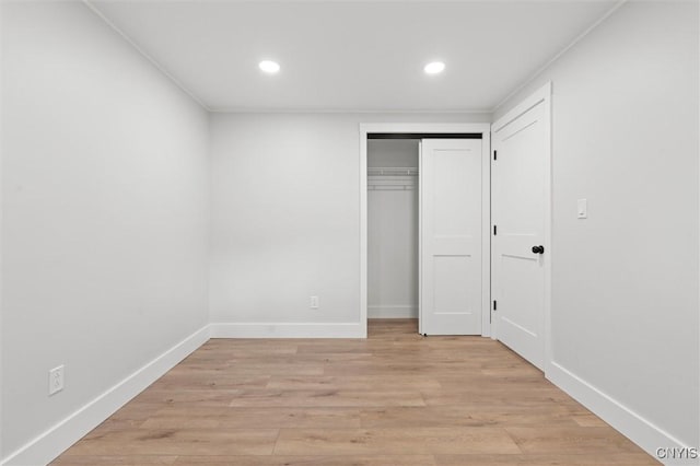 105 Benoit Dr, Geddes, NY 13209 - unfurnished bedroom with recessed lighting, light wood finished floors, and a closet