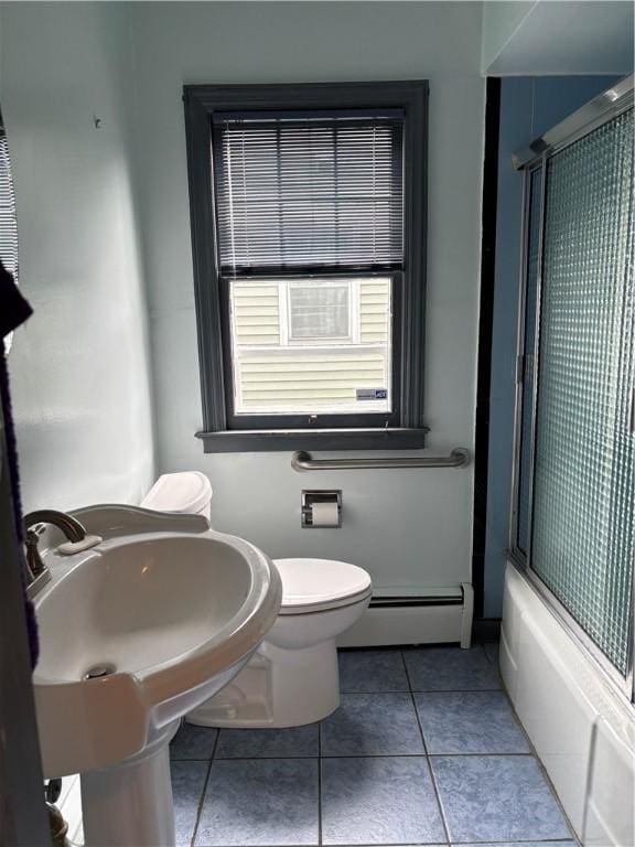 20-22 N Belmont Cir, Oneonta, NY 13820 - bathroom featuring a baseboard radiator, tile patterned flooring, and enclosed tub / shower combo