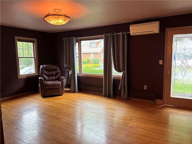 20-22 N Belmont Cir, Oneonta, NY 13820 - living area with a wall mounted air conditioner and wood finished floors