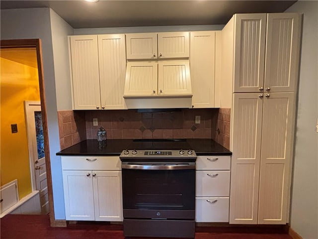 20-22 N Belmont Cir, Oneonta, NY 13820 - kitchen featuring electric stove, dark countertops, decorative backsplash, and exhaust hood