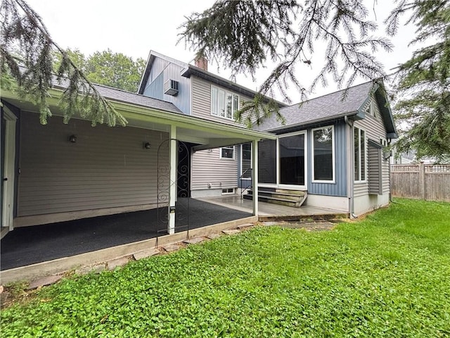 20-22 N Belmont Cir, Oneonta, NY 13820 - rear view of property with entry steps, a patio area, a chimney, a carport, and a shingled roof