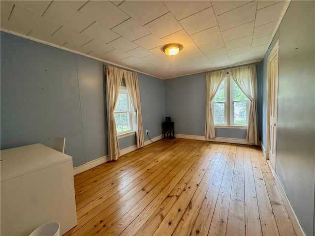 44 Bloom St, Butternuts, NY 13776 - unfurnished room with light wood finished floors, healthy amount of natural light, and crown molding