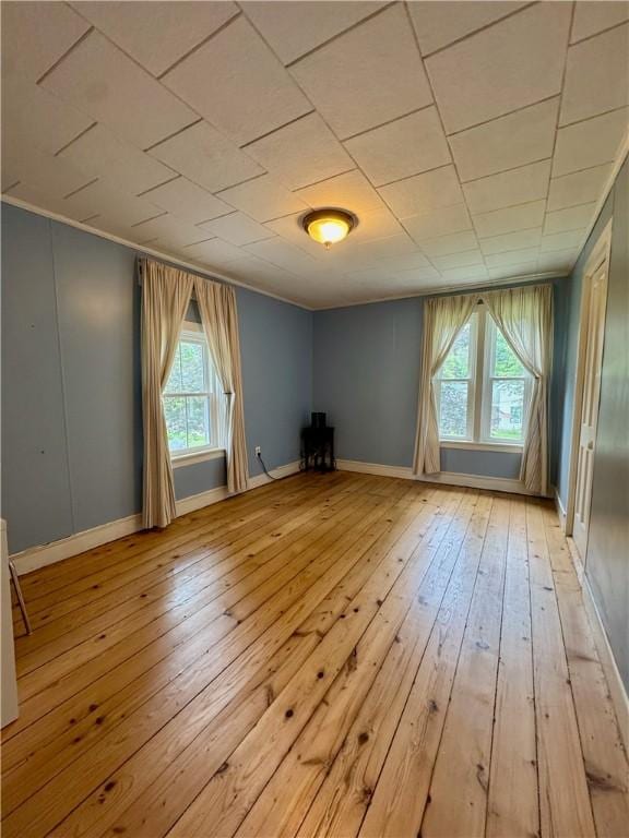 44 Bloom St, Butternuts, NY 13776 - unfurnished room featuring light wood-style flooring and crown molding