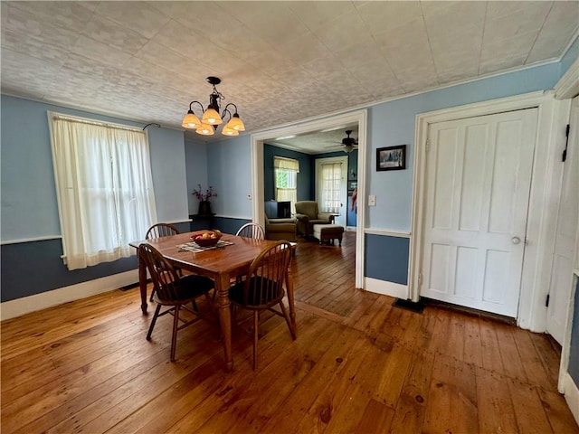 44 Bloom St, Butternuts, NY 13776 - dining room with a chandelier, wood-type flooring, ceiling fan, and ornamental molding