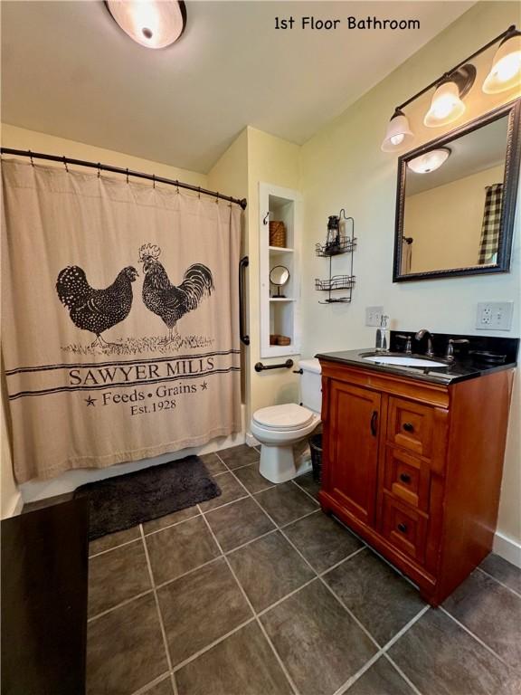 44 Bloom St, Butternuts, NY 13776 - full bathroom with vanity, tile patterned floors, and a shower with curtain