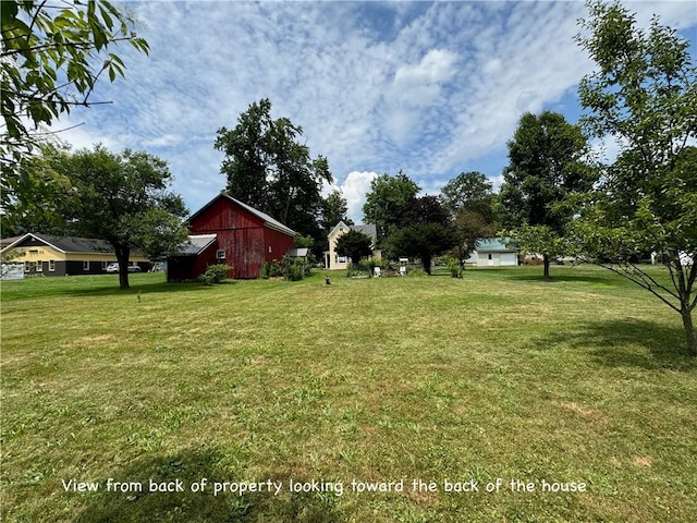 44 Bloom St, Butternuts, NY 13776 - view of grassy yard with an outdoor structure and a barn