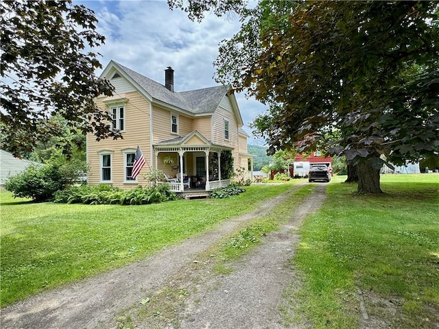 44 Bloom St, Butternuts, NY 13776 - victorian home with driveway, covered porch, a front yard, and a chimney