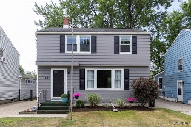 451 Moore Ave, Tonawanda, NY 14223 - colonial home with a chimney and a front lawn