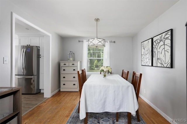 451 Moore Ave, Tonawanda, NY 14223 - dining room with light wood-style floors and baseboards