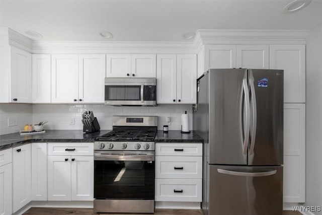 451 Moore Ave, Tonawanda, NY 14223 - kitchen with stainless steel appliances, white cabinetry, backsplash, dark stone countertops, and dark wood-style floors