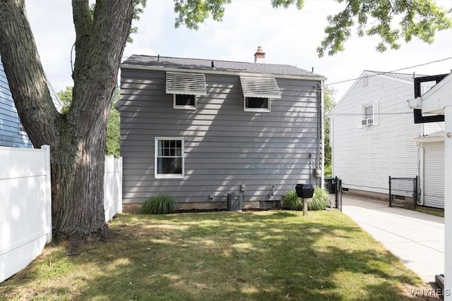 451 Moore Ave, Tonawanda, NY 14223 - rear view of house featuring a chimney