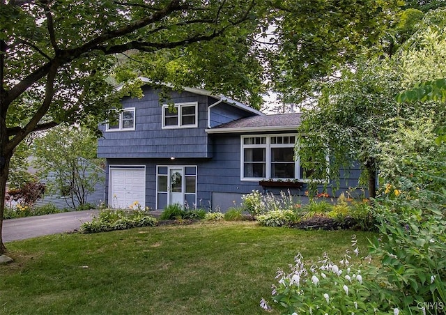 112 Haverhill Dr, Dewitt, NY 13214 - tri-level home with a garage, a front lawn, and driveway