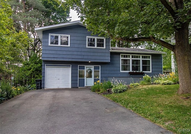 112 Haverhill Dr, Dewitt, NY 13214 - split level home with an attached garage, driveway, and a front yard