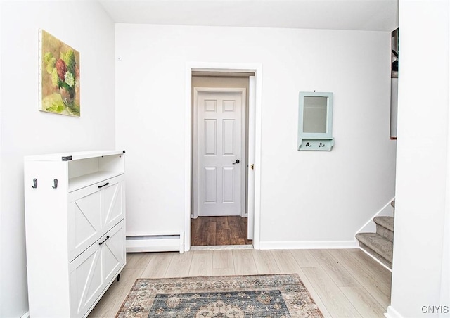112 Haverhill Dr, Dewitt, NY 13214 - foyer entrance with baseboard heating, light wood finished floors, and stairs