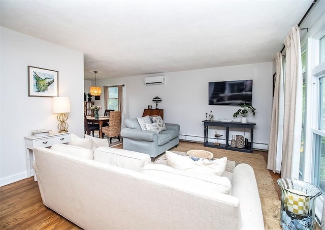 112 Haverhill Dr, Dewitt, NY 13214 - living area with a wall mounted AC and wood finished floors