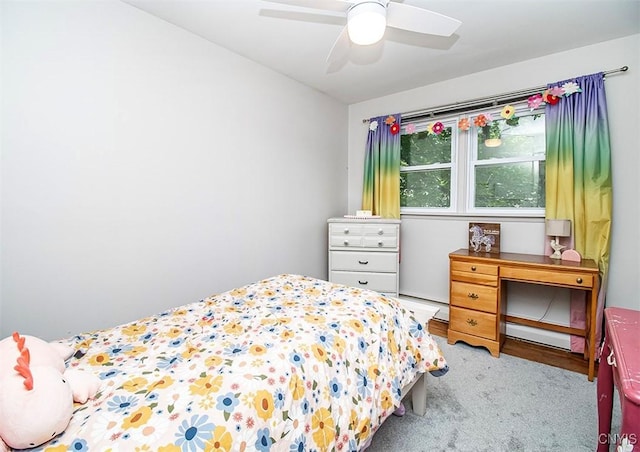 112 Haverhill Dr, Dewitt, NY 13214 - carpeted bedroom with a baseboard radiator and ceiling fan