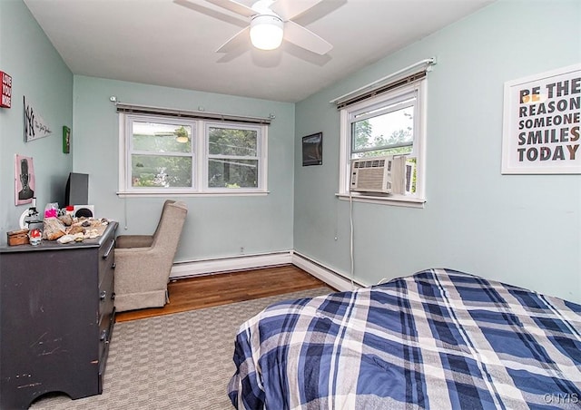 112 Haverhill Dr, Dewitt, NY 13214 - bedroom with wood finished floors, cooling unit, a baseboard heating unit, and a ceiling fan