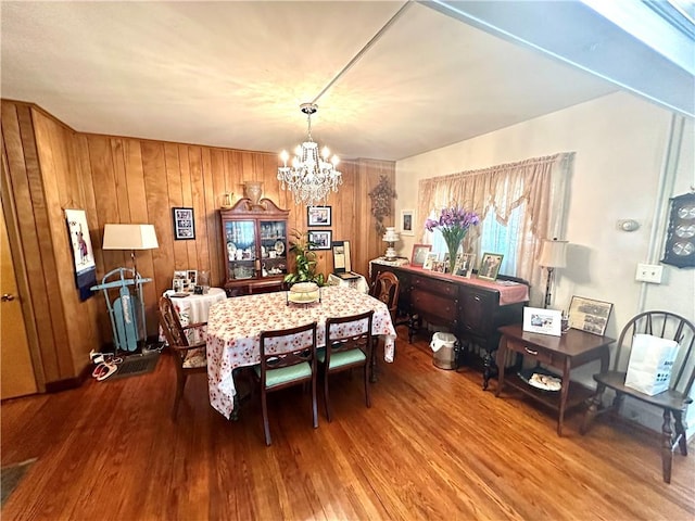 750 Reservoir St, Elmira City, NY 14905 - dining area with a chandelier, wood finished floors, and wood walls