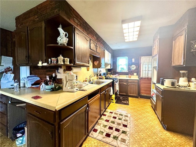 750 Reservoir St, Elmira City, NY 14905 - kitchen featuring stainless steel stove, open shelves, light countertops, light floors, and dark brown cabinets