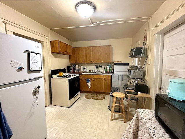 750 Reservoir St, Elmira City, NY 14905 - kitchen featuring white appliances, brown cabinetry, and light countertops