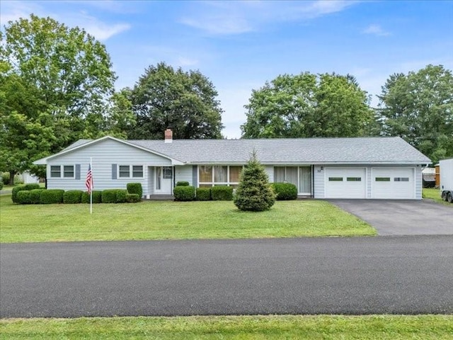 12 Sunset Dr, Afton, NY 13730 - ranch-style house featuring asphalt driveway, a garage, a front yard, and a chimney