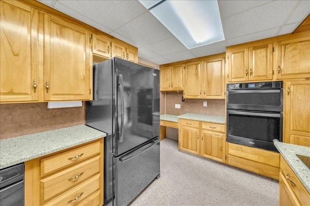 12 Sunset Dr, Afton, NY 13730 - kitchen featuring black appliances, a paneled ceiling, light stone counters, light carpet, and light brown cabinets
