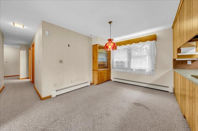 12 Sunset Dr, Afton, NY 13730 - unfurnished dining area featuring a baseboard radiator and light carpet