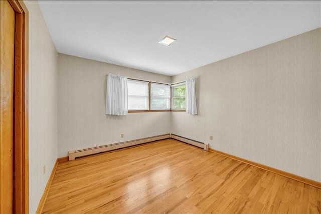 12 Sunset Dr, Afton, NY 13730 - unfurnished room with wood finished floors and baseboard heating