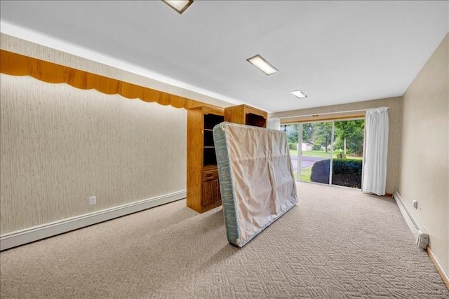 12 Sunset Dr, Afton, NY 13730 - unfurnished room with carpet floors, a baseboard heating unit, and a baseboard radiator
