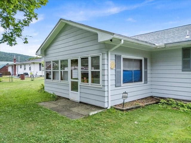 12 Sunset Dr, Afton, NY 13730 - view of side of property featuring a lawn and a shingled roof