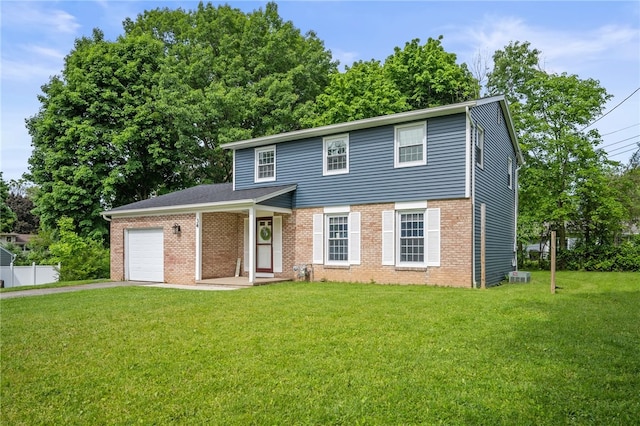 34 Stonewall Ct, Greece, NY 14615 - view of front of house with an attached garage, a front lawn, driveway, and brick siding
