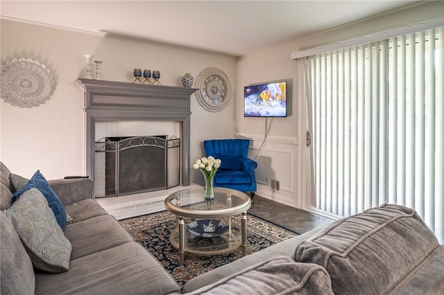 34 Stonewall Ct, Greece, NY 14615 - living room featuring a decorative wall and a fireplace with raised hearth