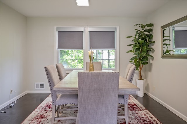 34 Stonewall Ct, Greece, NY 14615 - dining room featuring baseboards and dark wood finished floors