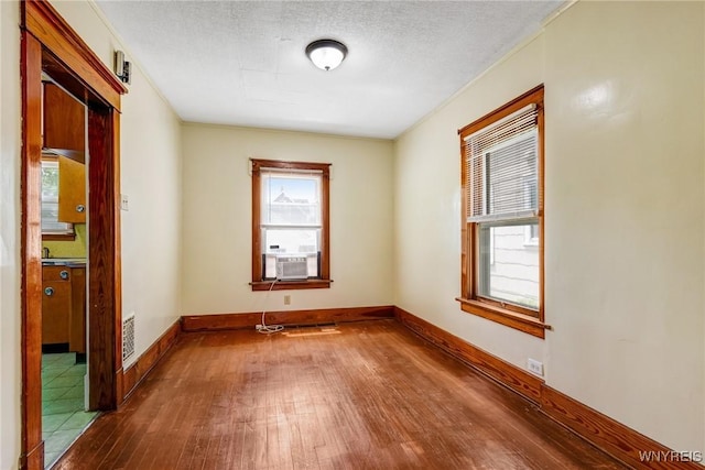 2239 Willow Ave, Niagara Falls, NY 14305 - empty room featuring dark wood-type flooring and cooling unit