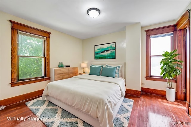 2239 Willow Ave, Niagara Falls, NY 14305 - bedroom with multiple windows and wood-type flooring