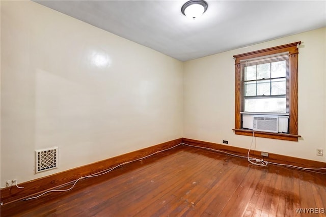 2239 Willow Ave, Niagara Falls, NY 14305 - spare room with cooling unit and hardwood / wood-style flooring