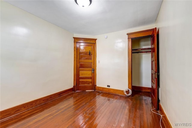 2239 Willow Ave, Niagara Falls, NY 14305 - unfurnished bedroom featuring dark wood finished floors and baseboards