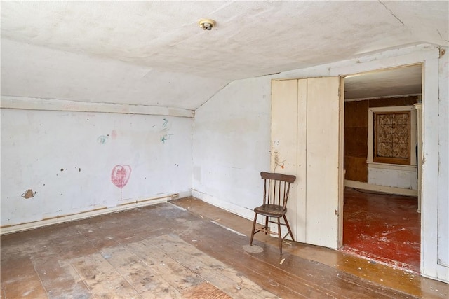 11 Walnut St, Phelps, NY 14533 - empty room featuring lofted ceiling, hardwood / wood-style floors, and fire sprinkler in ceiling