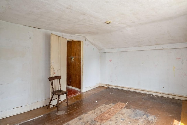 11 Walnut St, Phelps, NY 14533 - unfurnished room with hardwood / wood-style floors and vaulted ceiling
