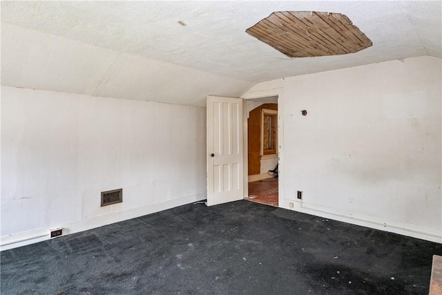 11 Walnut St, Phelps, NY 14533 - spare room featuring lofted ceiling