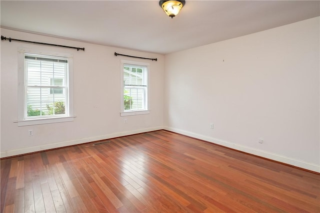 11 Walnut St, Phelps, NY 14533 - spare room featuring wood-type flooring and baseboards